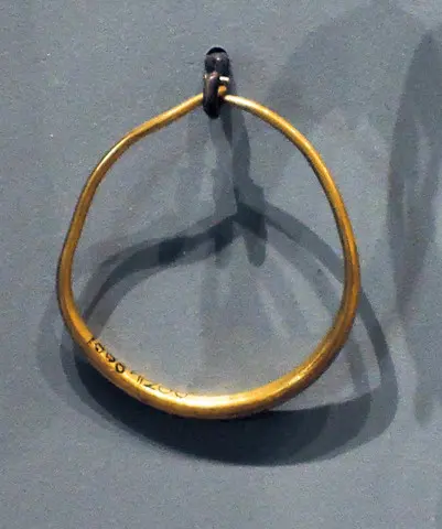 Gold hoop earring - image 1