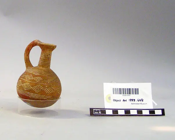 Red Polished incised globular long-necked juglet - image 1