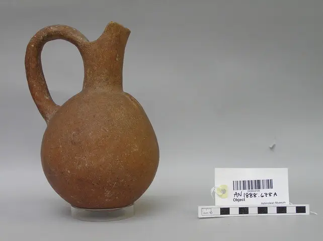 Red Polished jug with short cut-away neck and spout - image 1