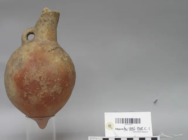 Red Polished IV Jug withcut-away spout and mastoid foot - image 1