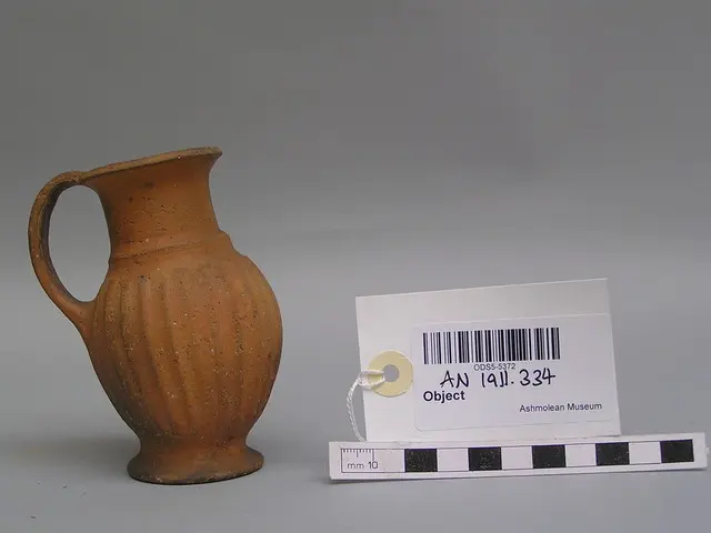 Handmade small bucchero jug with thin brown slip - image 1