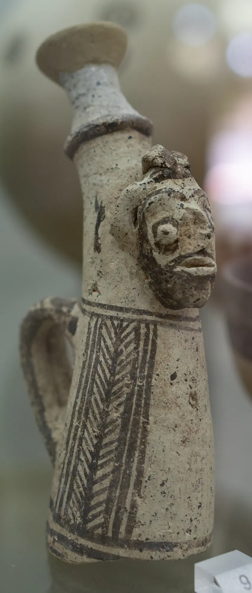 Small spout with an attached human face - image 1