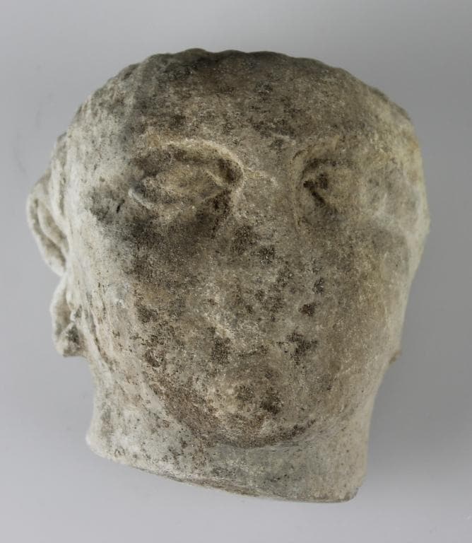 Head from a votive statue - image 1