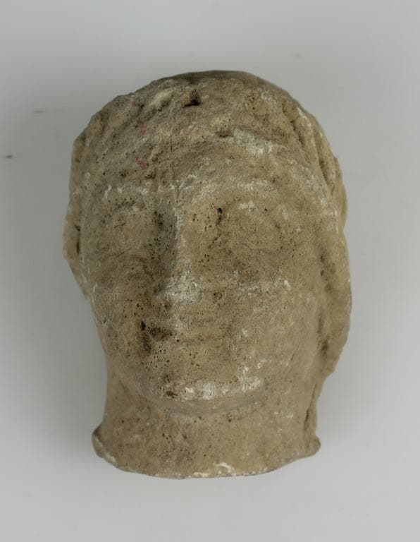 Head from a votive statue - image 1