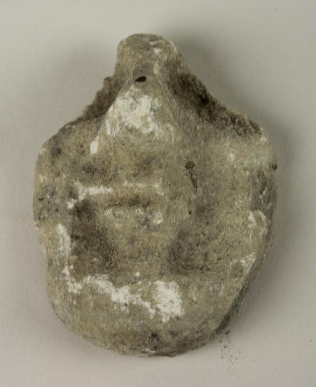 Fragment from a head of a votive statuette - image 1