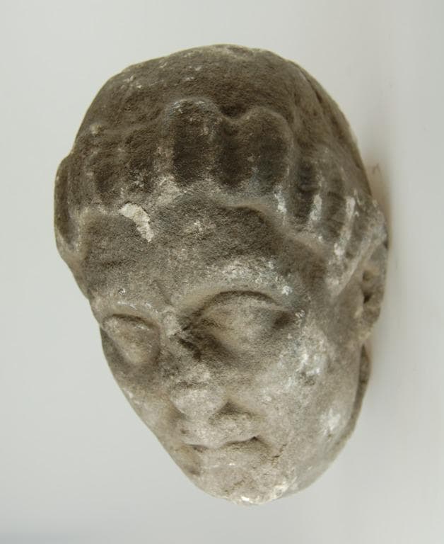 Head from a votive statue - image 1