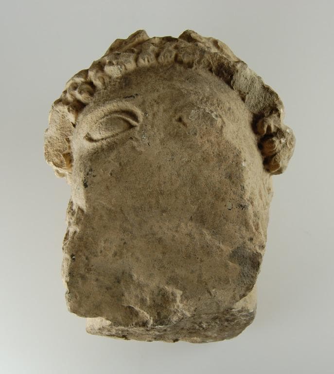 Head from a votive statue - image 1