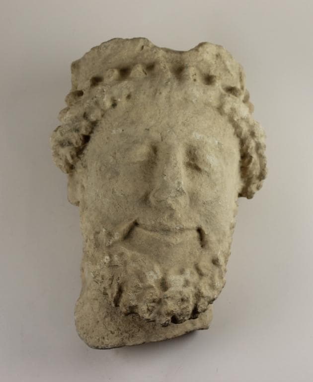 Head from a votive statue - image 1
