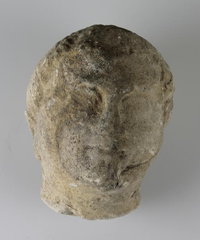 Head from a votive statue - image 1