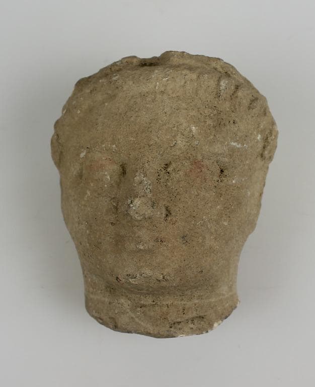Head from a votive statue - image 1