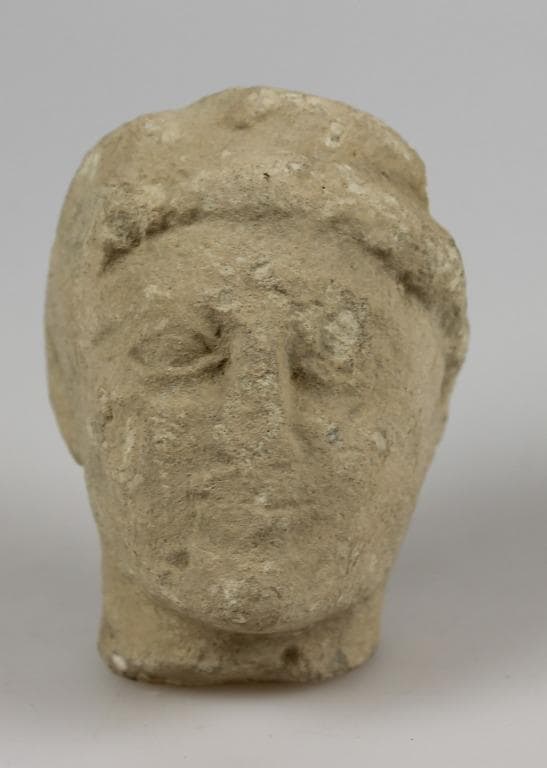 Head from a votive statue - image 1