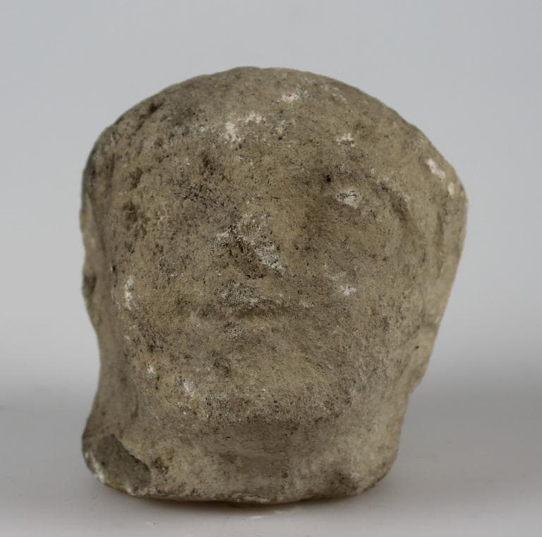 Head from a votive statue - image 1