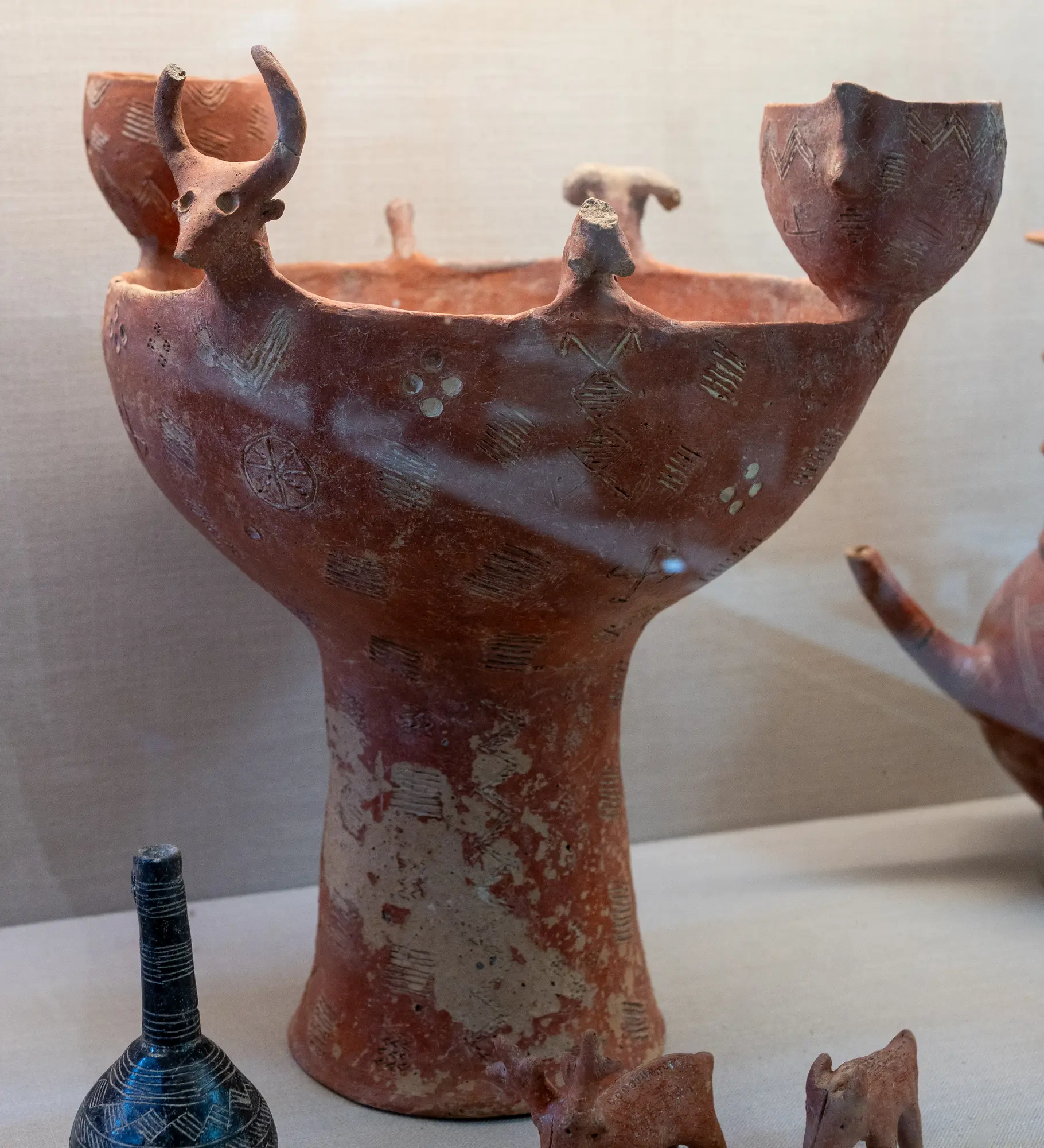 Red Polished Bowl with Stand and Bull decoration - image 1