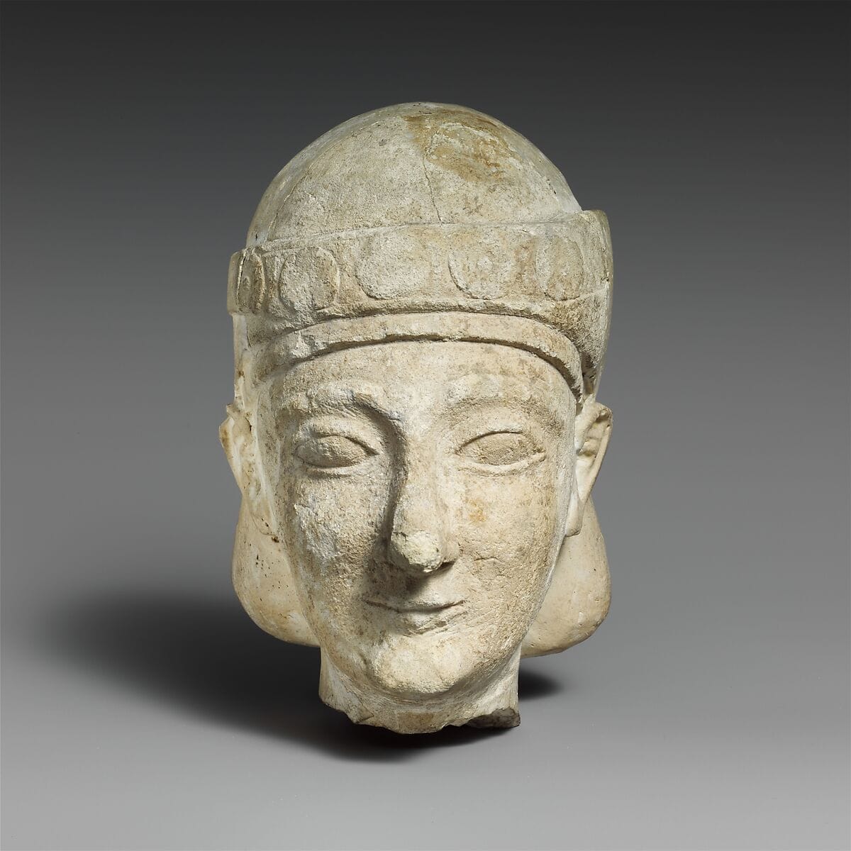 Limestone head of a beardless male with a diadem - image 1