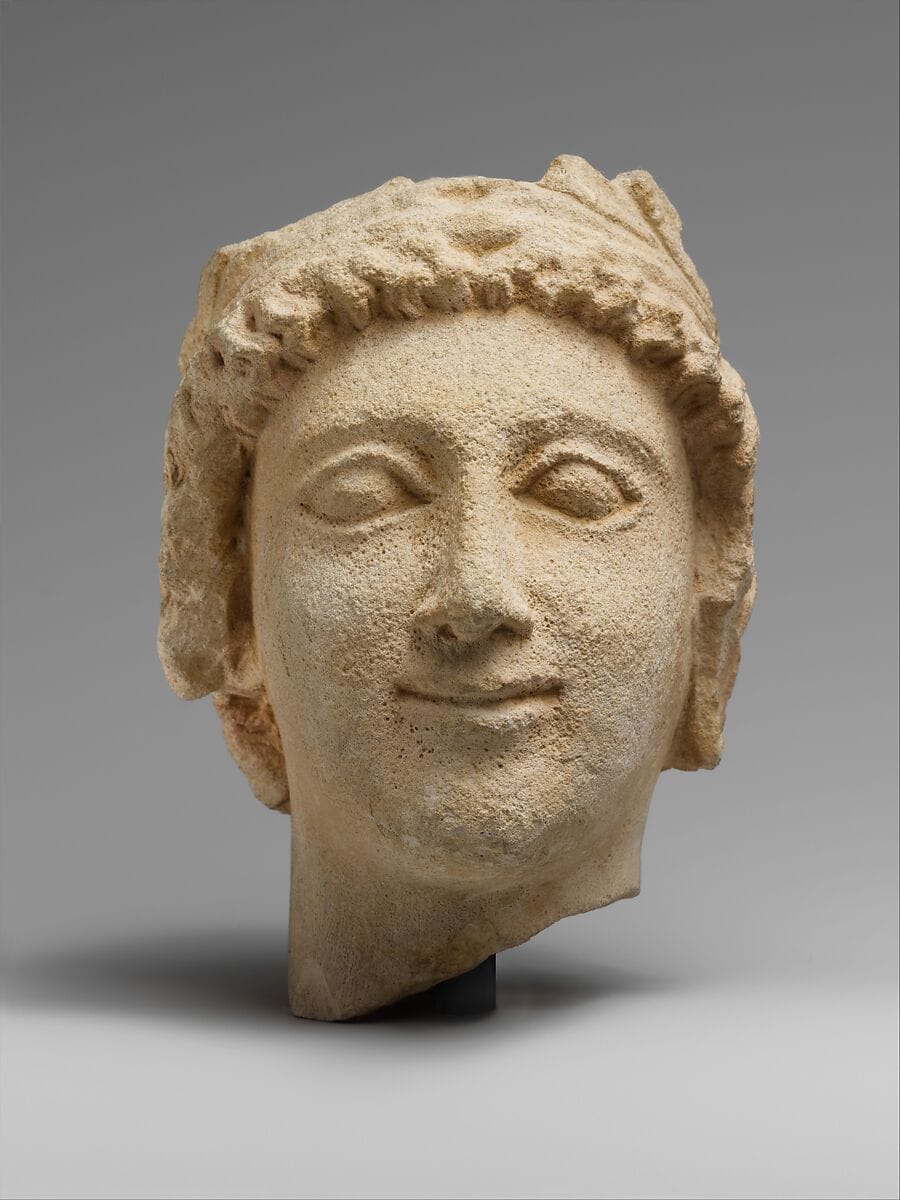 Limestone head of a wreathed youth - image 1