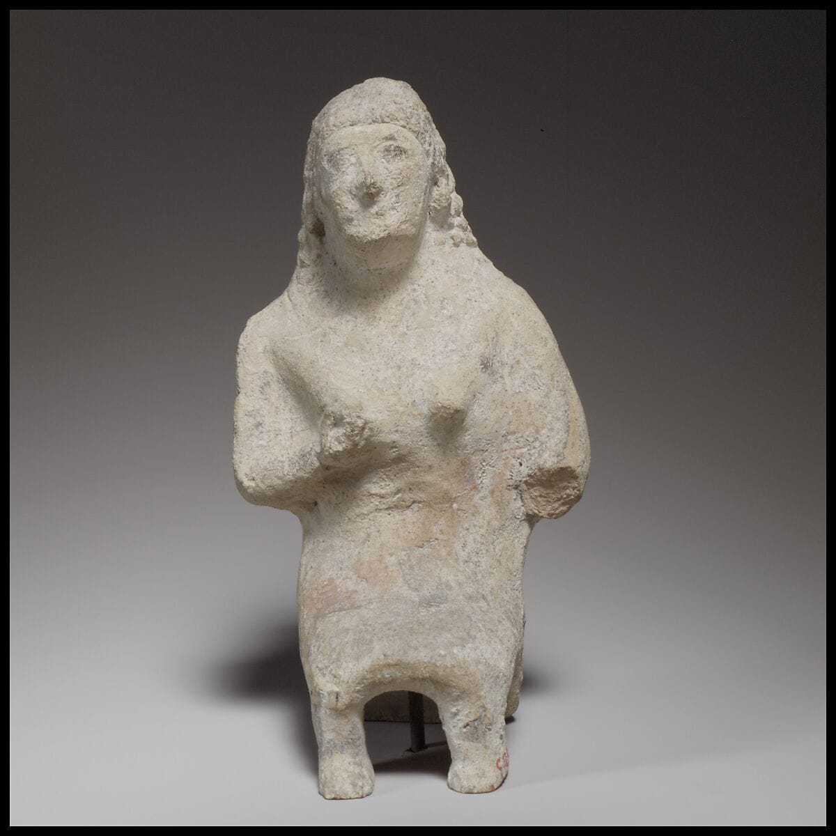 Seated female figurine - image 1