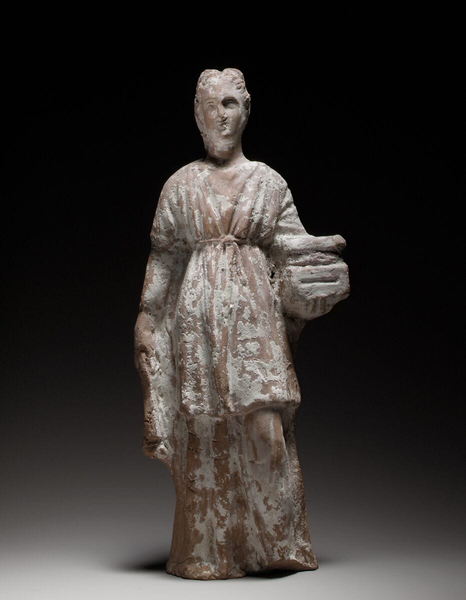 Terracotta figurine of a standing female votary holding a casket - image 1