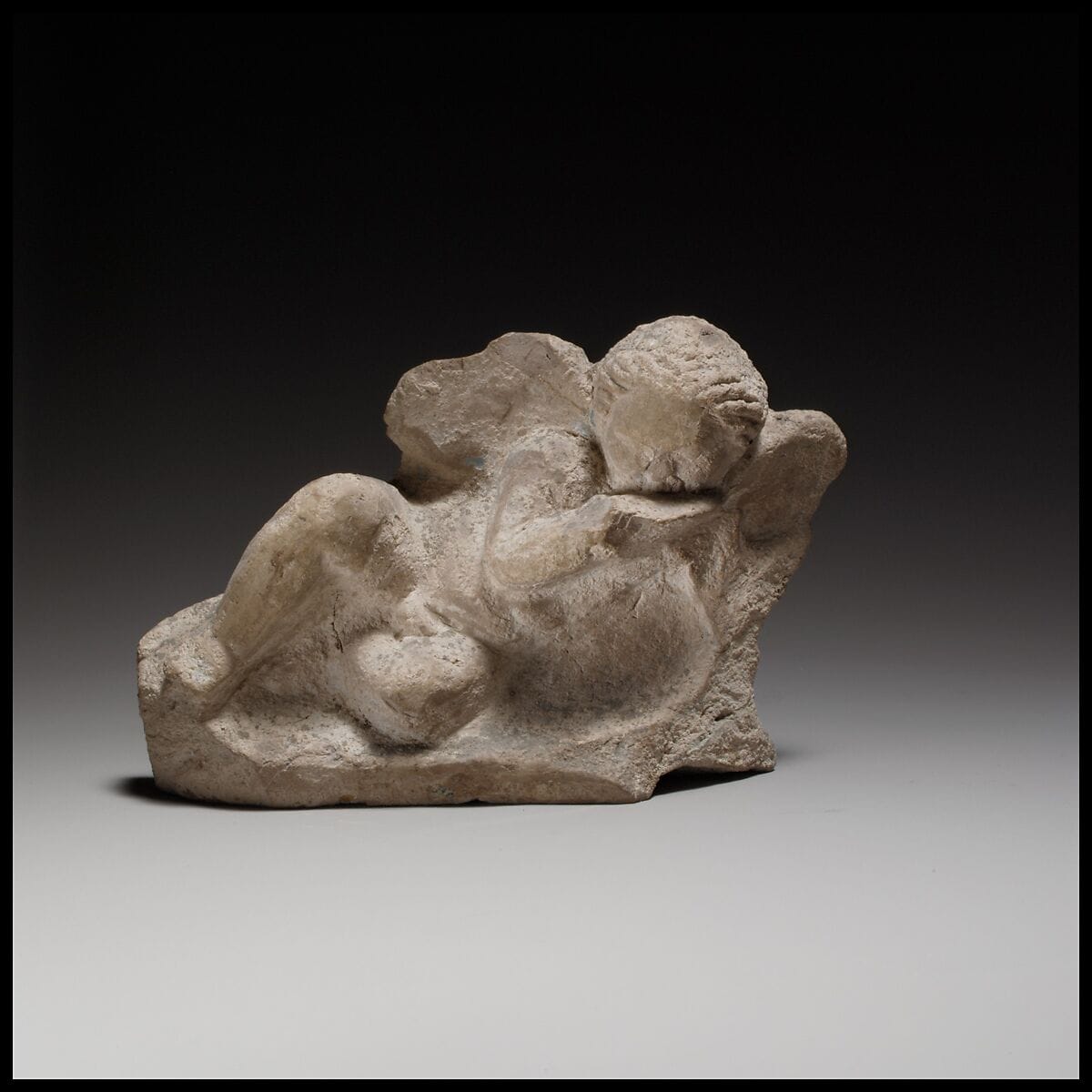 Terracotta statuette of Eros banqueting - image 1