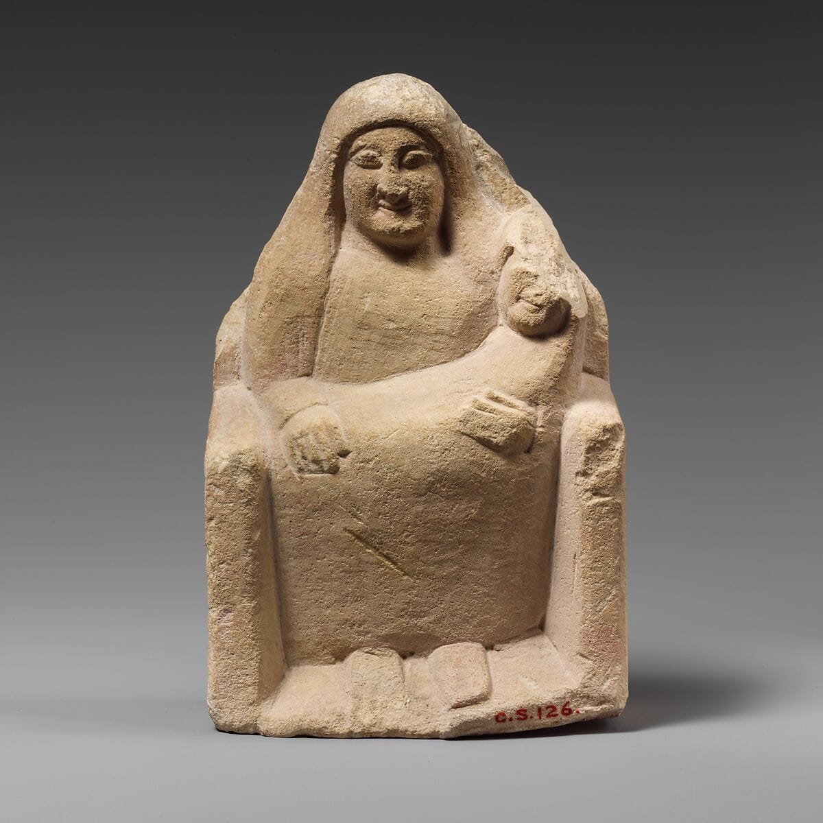 Seated limestone kourotrophos - image 1