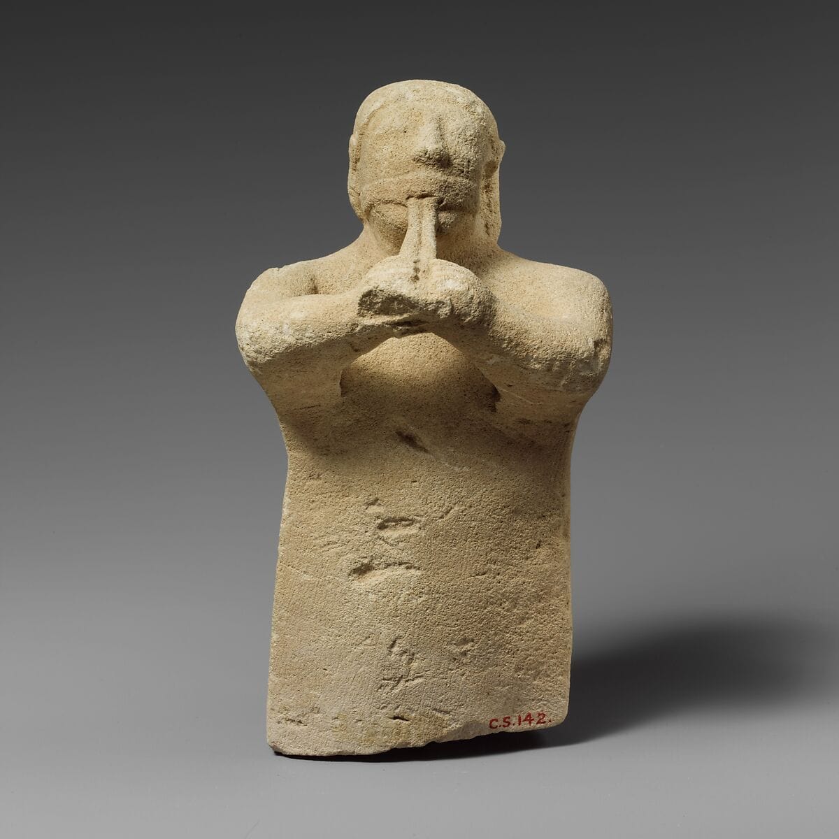 Limestone statuette of a male aulos player - image 1