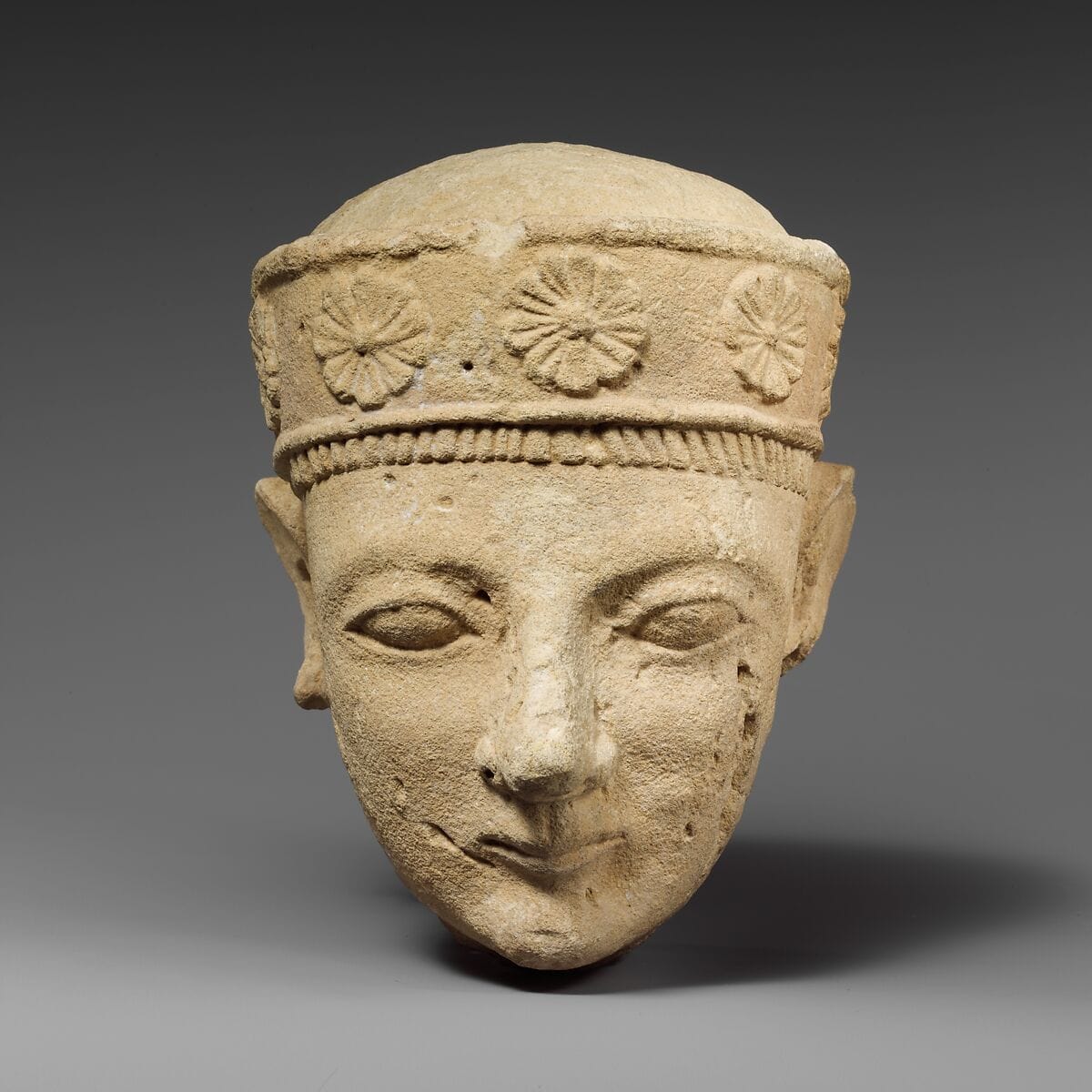 Limestone head of a beardless male with a diadem - image 1