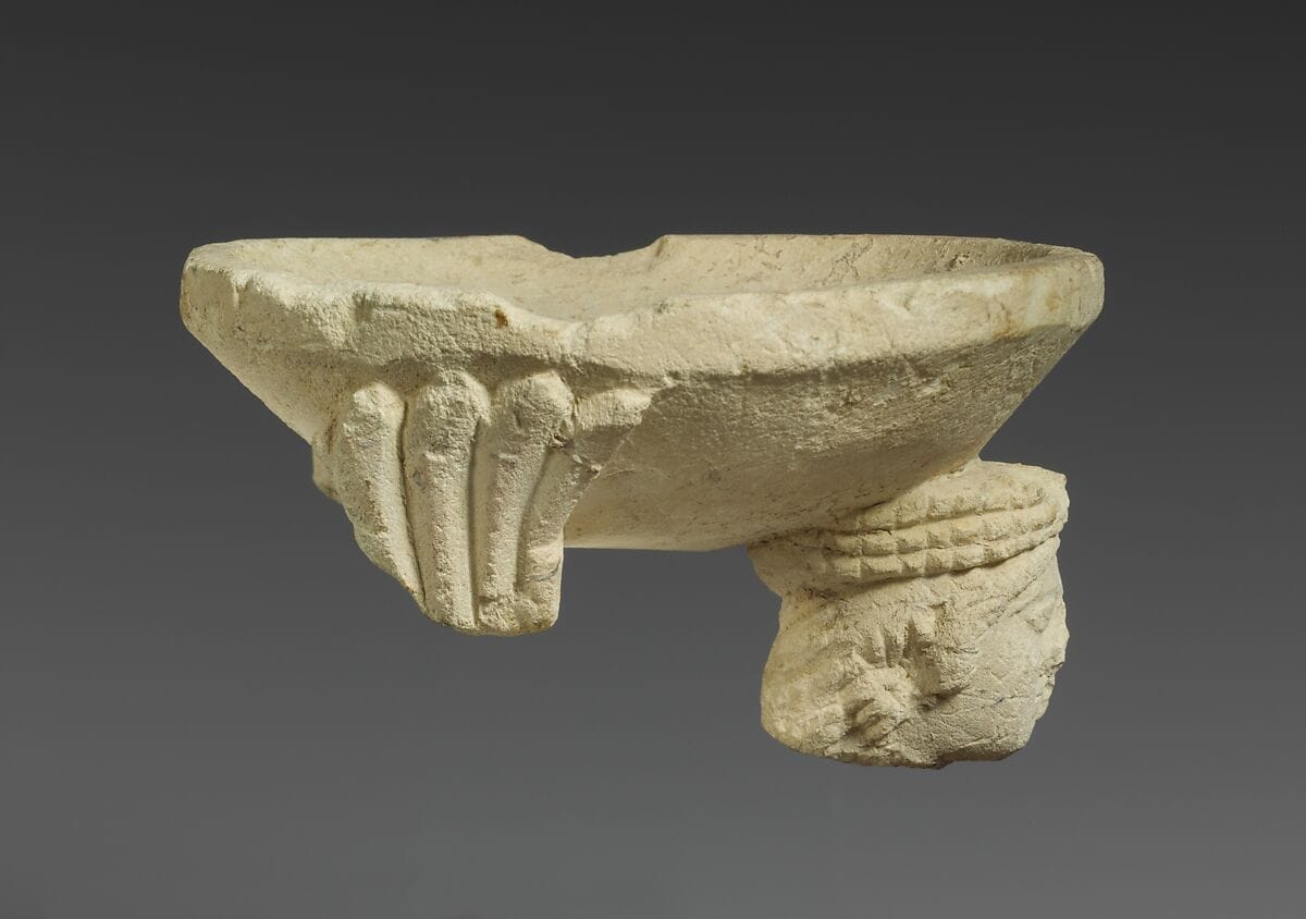 Limestone fragment of a sphinx supporting an incense burner - image 1