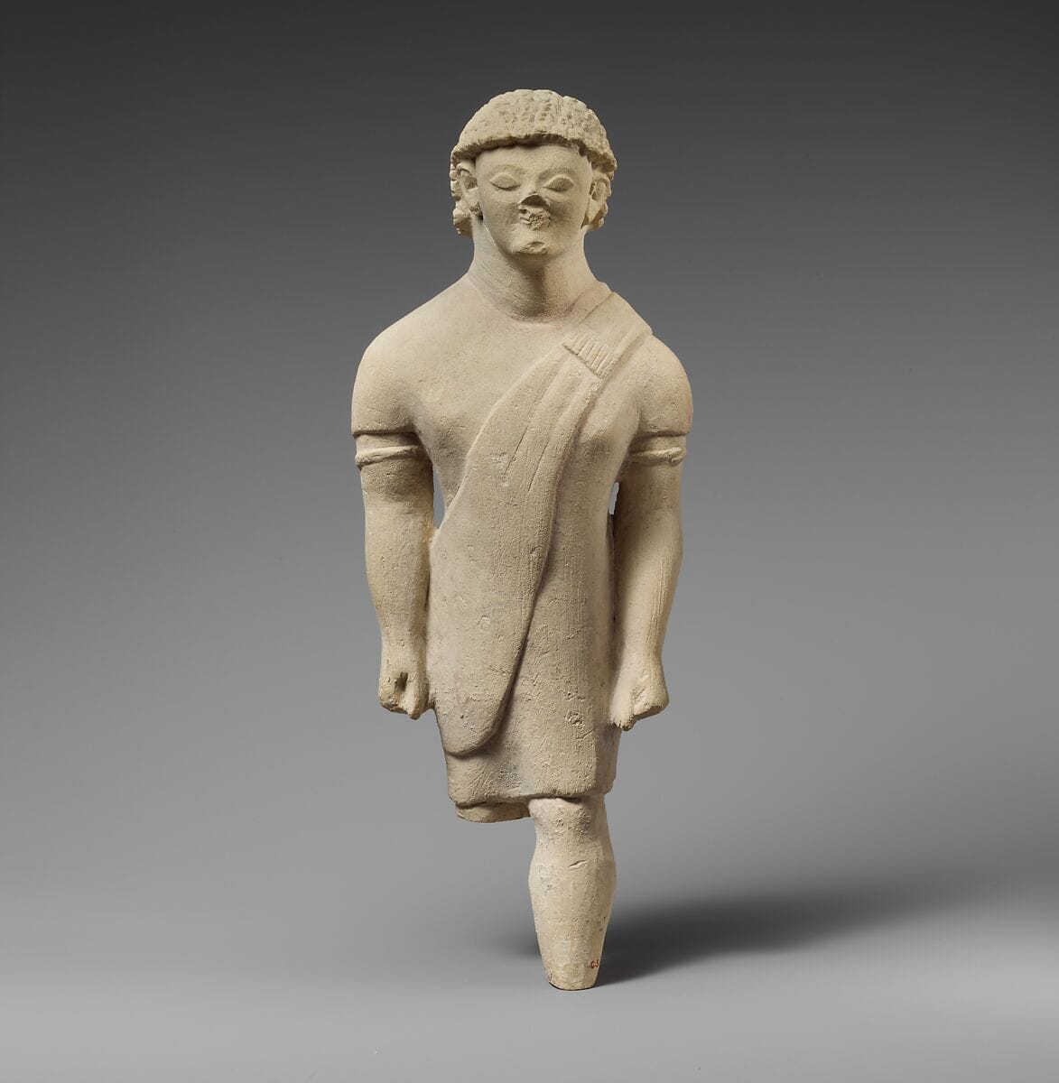 Limestone statuette of a beardless male votary in Greek dress - image 1