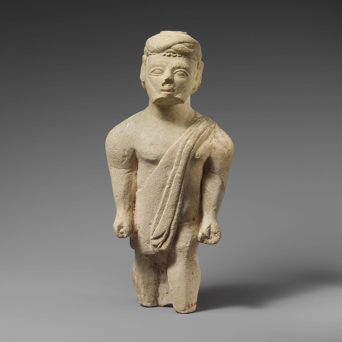 Limestone statuette of a bearded male votary in Greek dress - image 1