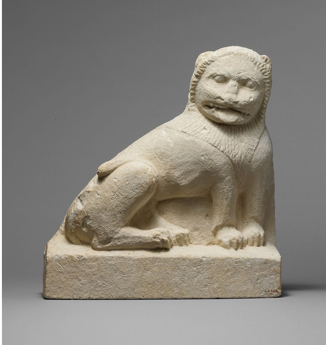 Limestone statue of a seated lion - image 1