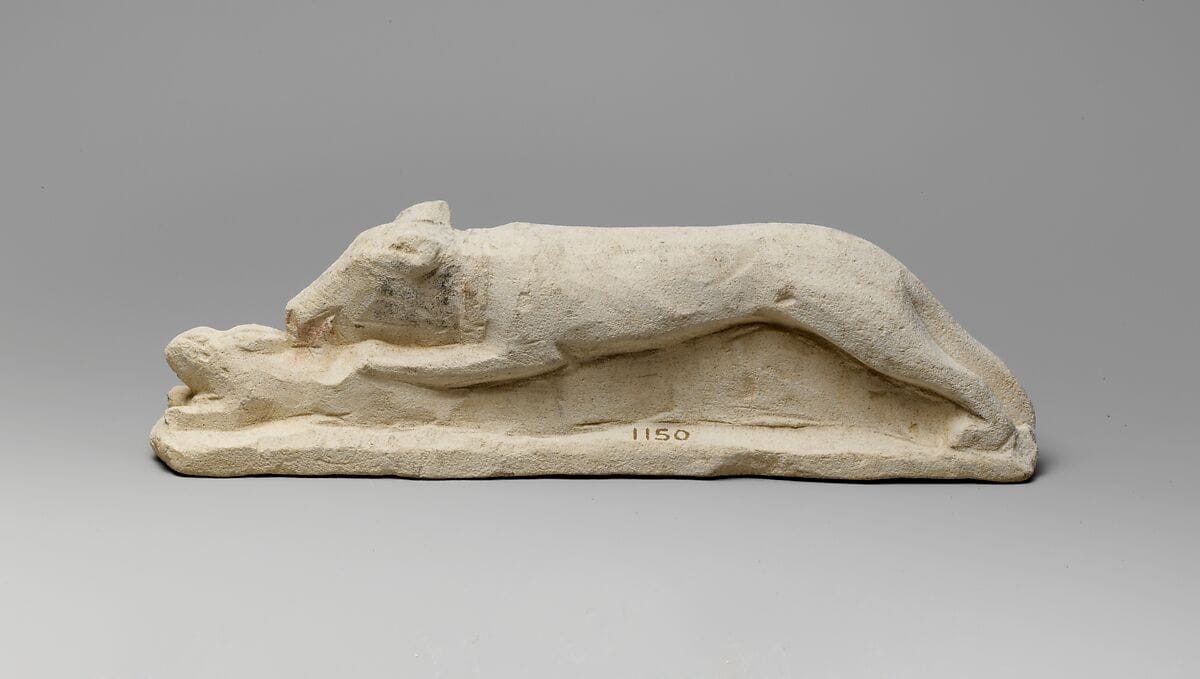 Limestone votive statuette of a hound seizing a hare - image 1