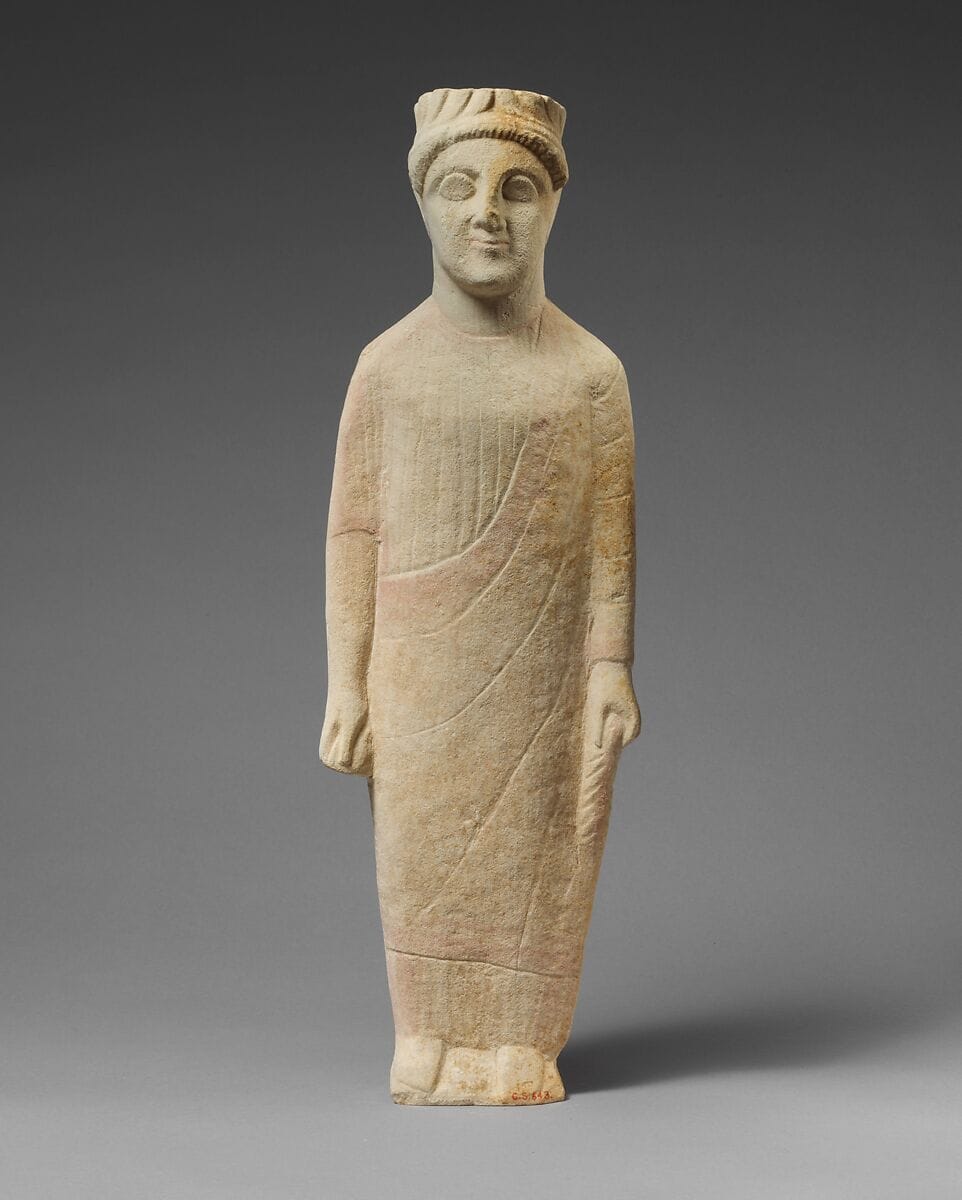 Limestone statuette of a beardless male votary with a wreath of leaves - image 1