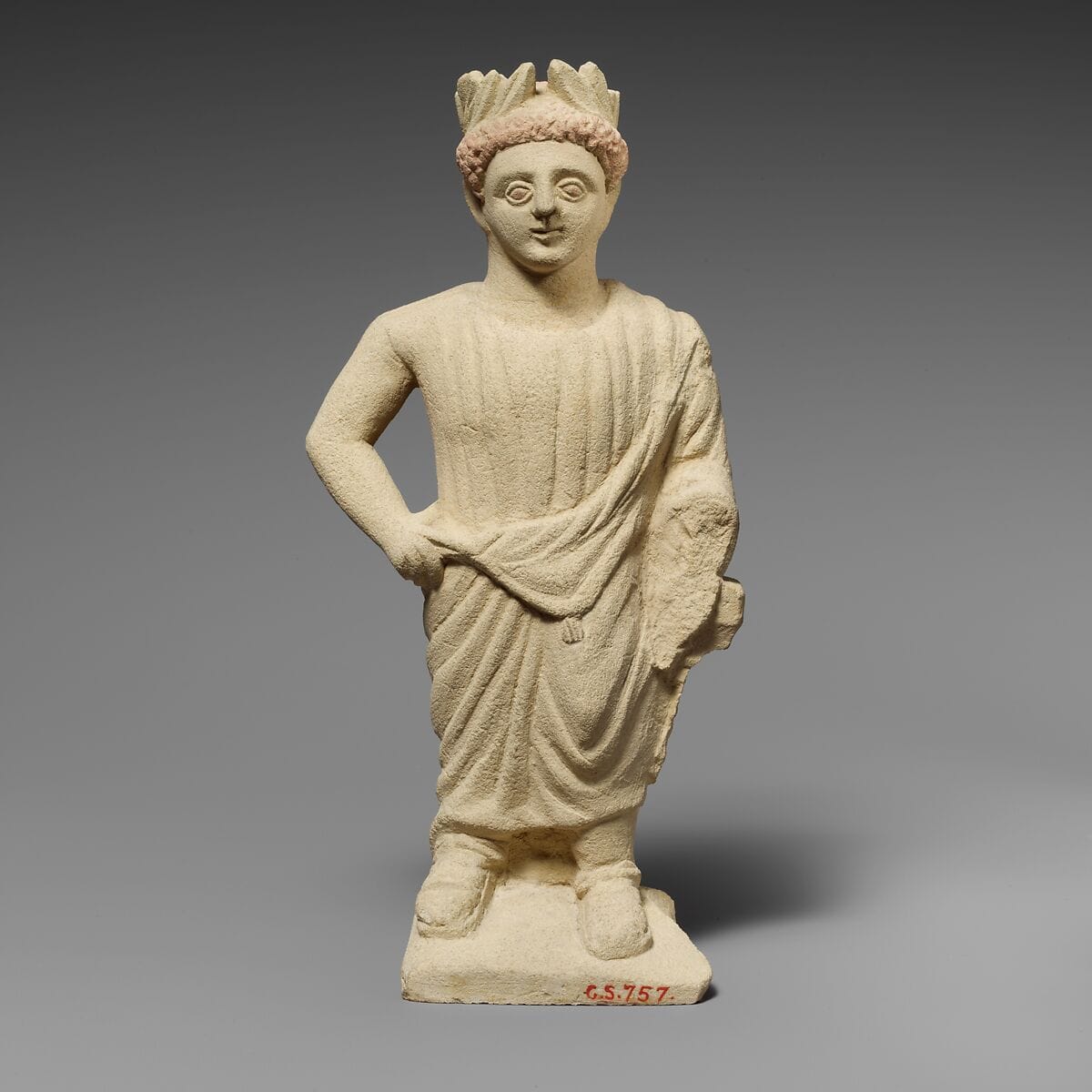 Limestone statuette of a beardless male votary with a wreath of leaves - image 1