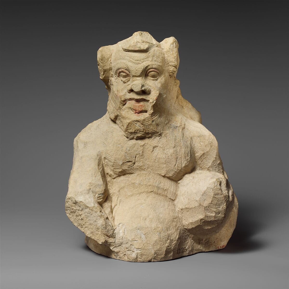 Fragment of a partly unfinished limestone statuette of a silen - image 1