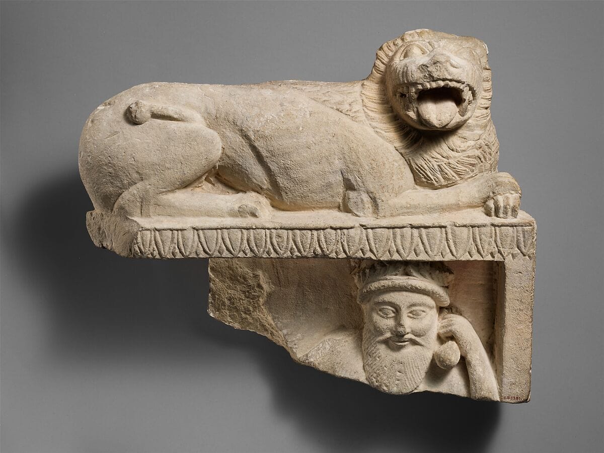 Limestone finial of a funerary stele with a recumbent lion and a banquet scene - image 1