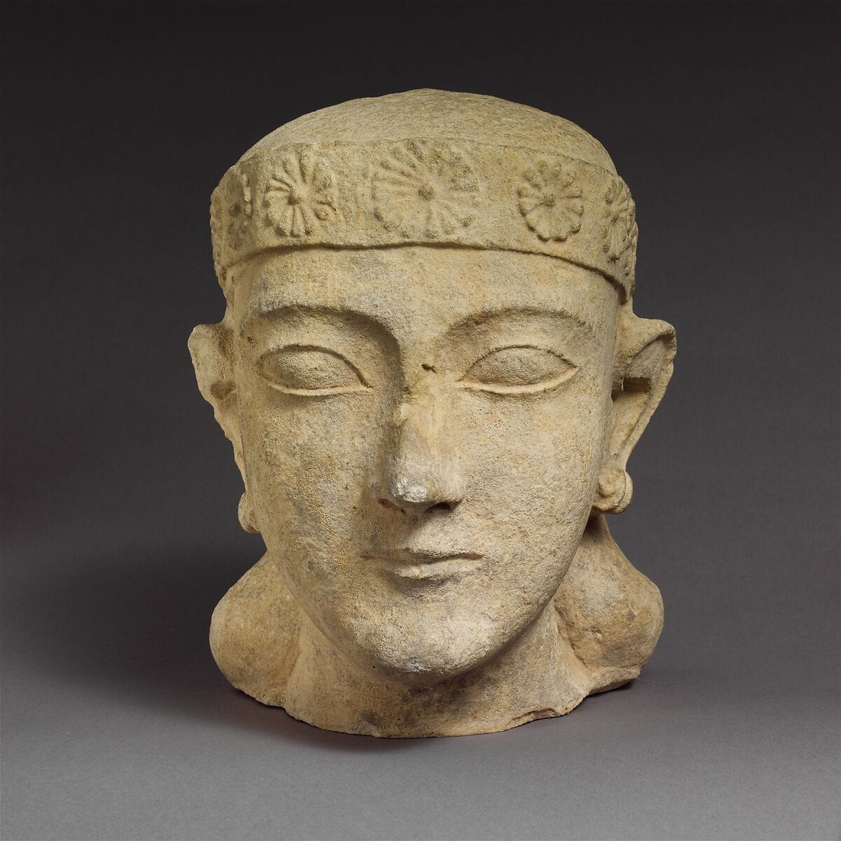 Limestone head of a beardless male with a diadem - image 1