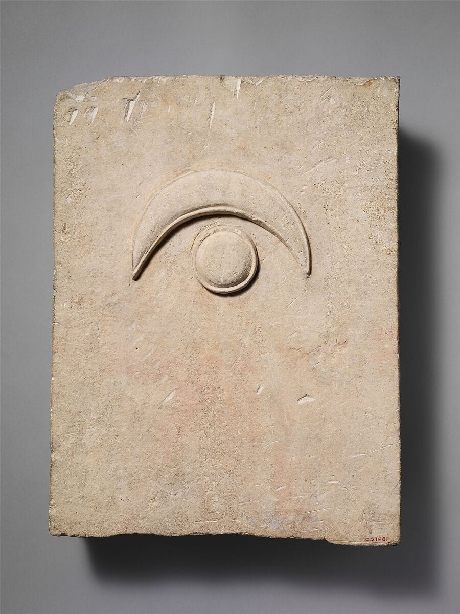 Fragment of a limestone funerary stele with a disk and a crescent - image 1