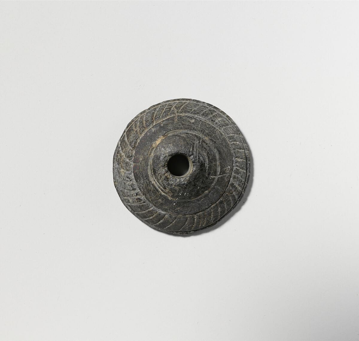 Schist spindle whorl - image 1