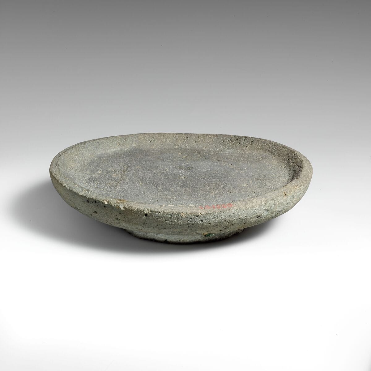 Vesicular basalt mortar or plate - image 1