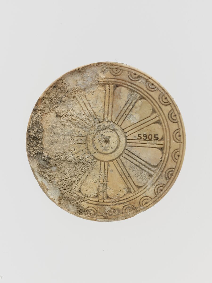 Ivory disk with rosette - image 1