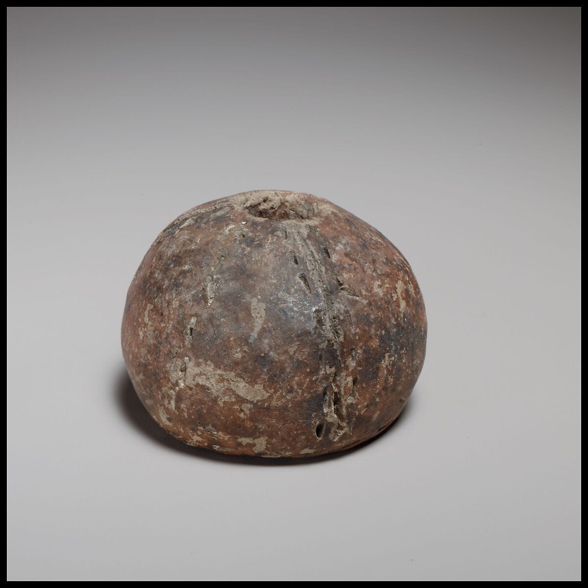 Spherical spindle-whorl with flat base - image 1