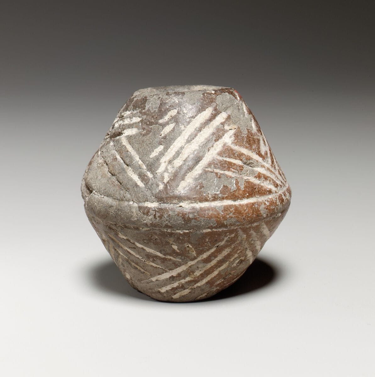 Terracotta biconical spindle-whorl with flat top - image 1