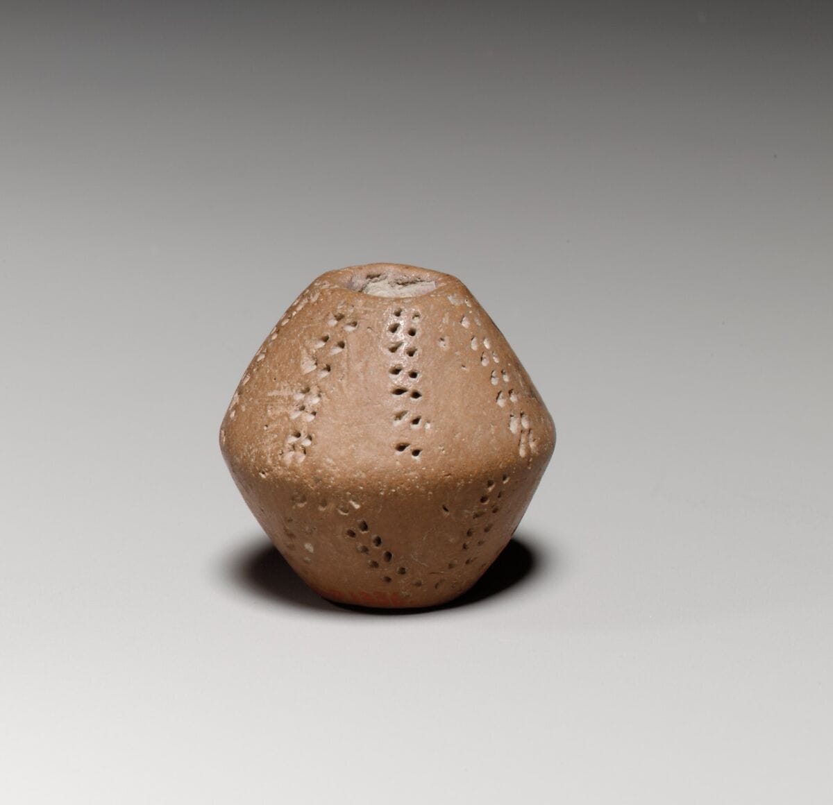 Small terracotta biconical spindle-whorl - image 1