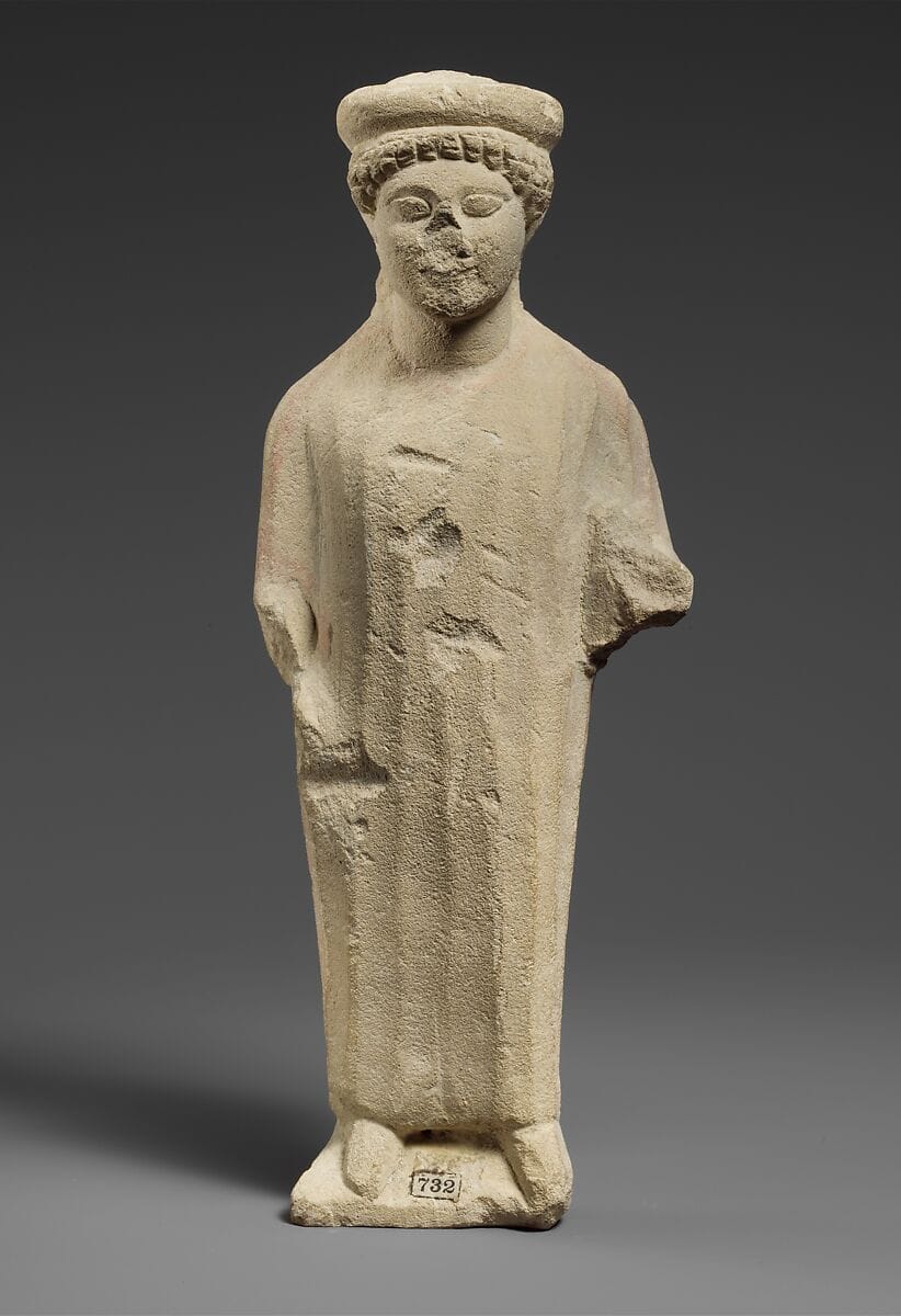 Limestone statuette of a boy with a flat headdress - image 1